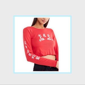 Urban Outfitters truly madly deeply dragon long sleeved red cropped top